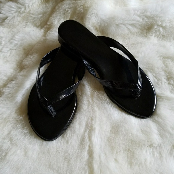 shiny black flip flops